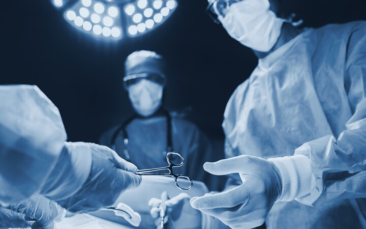Surgical team operating in a modern hospital
